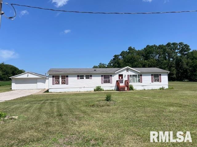 911 4th St, New Boston, IL 61272 - view of front of home featuring a detached garage, a front yard, and an outbuilding