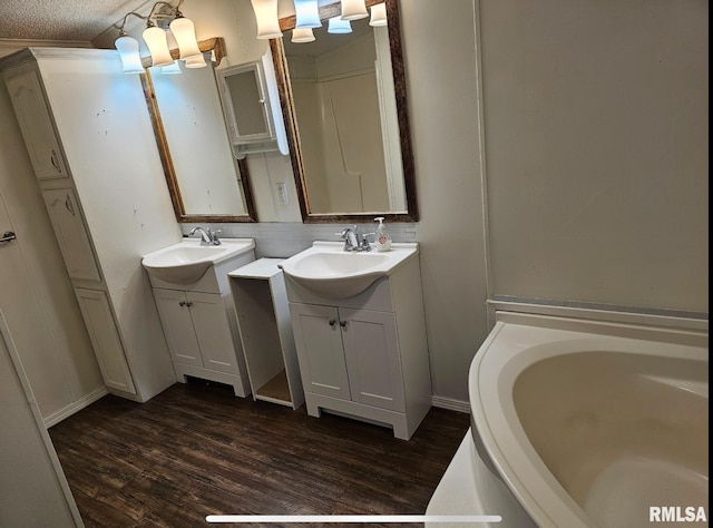 911 4th St, New Boston, IL 61272 - full bathroom with wood finished floors, two vanities, and a bath