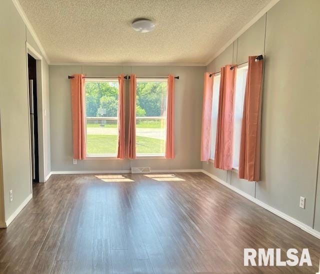 911 4th St, New Boston, IL 61272 - unfurnished room with a textured ceiling, dark wood-type flooring, and ornamental molding