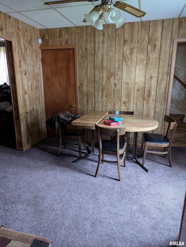 1507 N Lincoln Ave, Davenport, IA 52804 - dining space featuring wooden walls, breakfast area, carpet flooring, and a ceiling fan