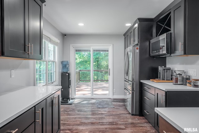 4932 Torrey Pines Ct, Davenport, IA 52807 - kitchen featuring stainless steel appliances, light countertops, recessed lighting, and dark wood-style flooring