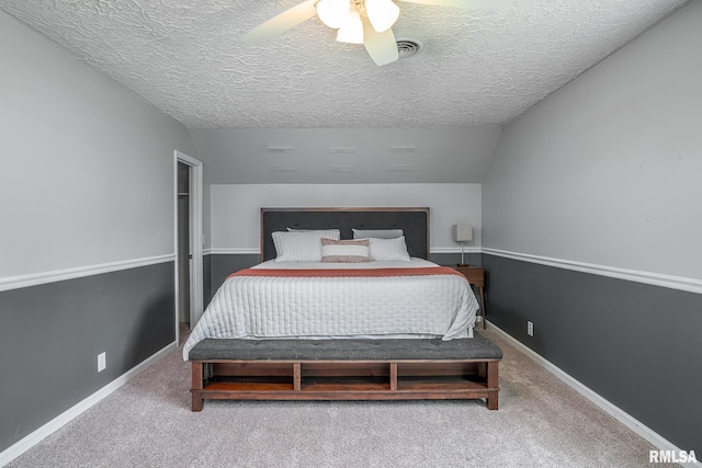 4932 Torrey Pines Ct, Davenport, IA 52807 - carpeted bedroom featuring a ceiling fan, a textured ceiling, and lofted ceiling
