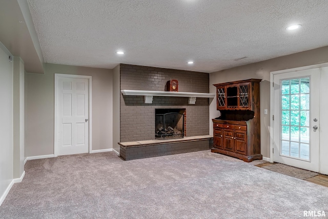 4932 Torrey Pines Ct, Davenport, IA 52807 - living room with a textured ceiling, carpet floors, a fireplace, and recessed lighting