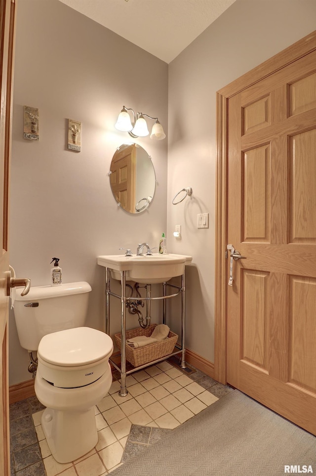 4581 180th St, Clinton, IA 52732 - bathroom with toilet and tile patterned flooring