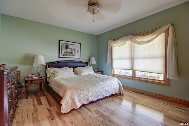 4581 180th St, Clinton, IA 52732 - bedroom featuring light wood-style floors and ceiling fan