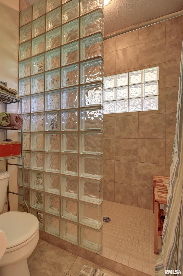 4581 180th St, Clinton, IA 52732 - full bathroom featuring tile patterned floors and a tile shower