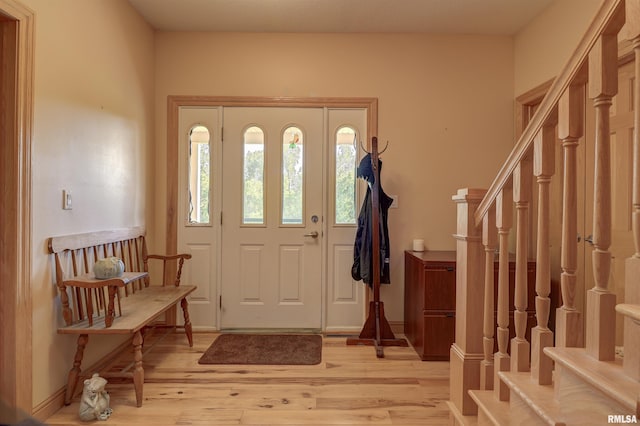 4581 180th St, Clinton, IA 52732 - entryway featuring stairway and light wood-type flooring