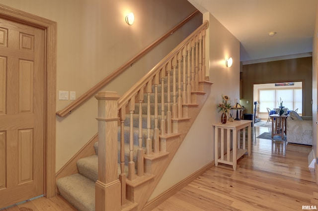 4581 180th St, Clinton, IA 52732 - stairs featuring wood-type flooring and baseboards