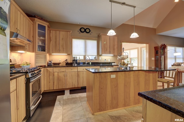 4581 180th St, Clinton, IA 52732 - kitchen with appliances with stainless steel finishes, range hood, a kitchen breakfast bar, a kitchen island, and light brown cabinets