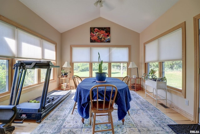 4581 180th St, Clinton, IA 52732 - dining space with vaulted ceiling, light wood-style floors, and a ceiling fan