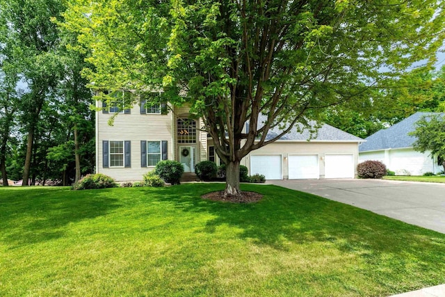 905 Bridgeview Place, Le Claire, IA 52753 - view of front of property featuring concrete driveway, a front yard, and an attached garage
