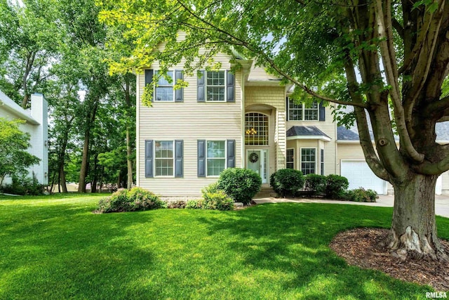 905 Bridgeview Place, Le Claire, IA 52753 - traditional-style home with a front lawn and an attached garage