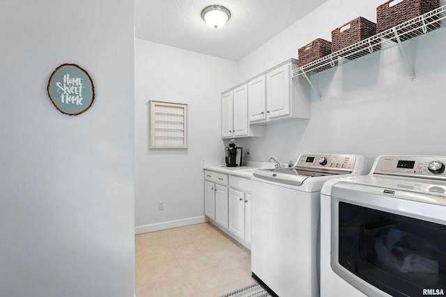 905 Bridgeview Place, Le Claire, IA 52753 - laundry room with washer and dryer, cabinet space, and light tile patterned flooring