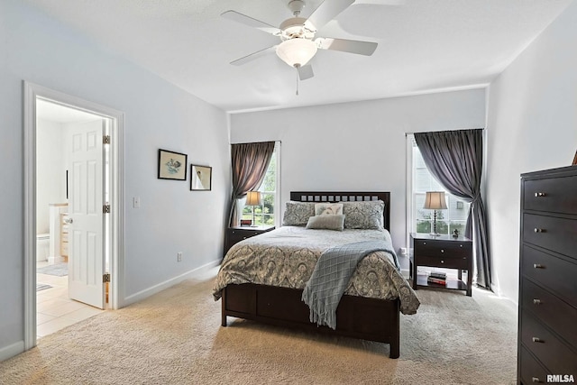 905 Bridgeview Place, Le Claire, IA 52753 - carpeted bedroom featuring ceiling fan and connected bathroom