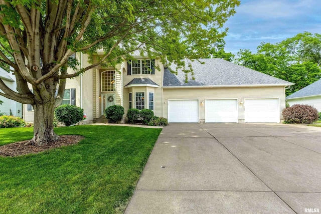 905 Bridgeview Place, Le Claire, IA 52753 - traditional-style home with driveway, a garage, a front lawn, and a shingled roof
