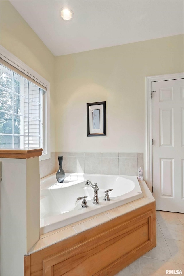 905 Bridgeview Place, Le Claire, IA 52753 - bathroom featuring a garden tub and tile patterned flooring