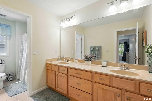 905 Bridgeview Place, Le Claire, IA 52753 - bathroom with double vanity and tile patterned floors