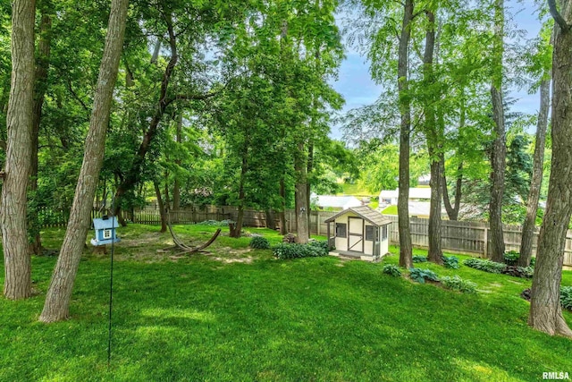 905 Bridgeview Place, Le Claire, IA 52753 - fenced backyard featuring a storage unit