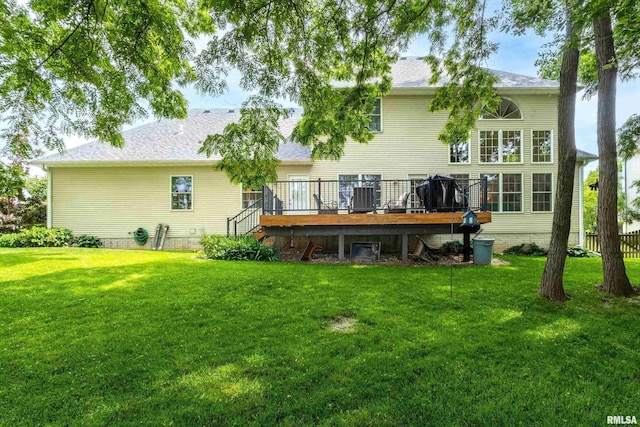 905 Bridgeview Place, Le Claire, IA 52753 - back of house with a wooden deck, a lawn, and a shingled roof