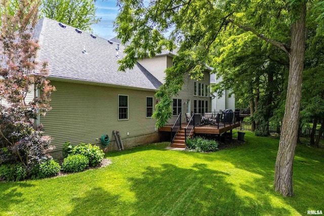 905 Bridgeview Place, Le Claire, IA 52753 - rear view of property with a deck, roof with shingles, and a yard