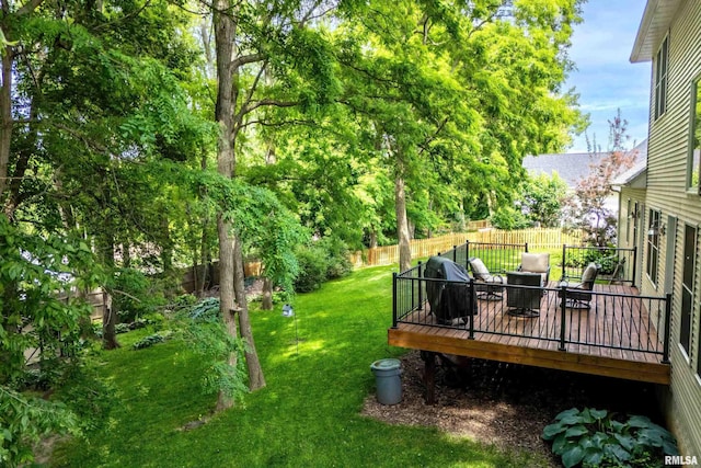 905 Bridgeview Place, Le Claire, IA 52753 - fenced backyard with a deck
