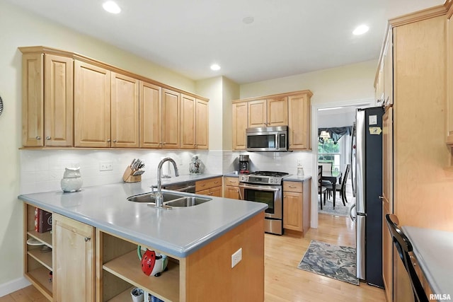 905 Bridgeview Place, Le Claire, IA 52753 - kitchen featuring appliances with stainless steel finishes, open shelves, light brown cabinets, light wood-style floors, and tasteful backsplash