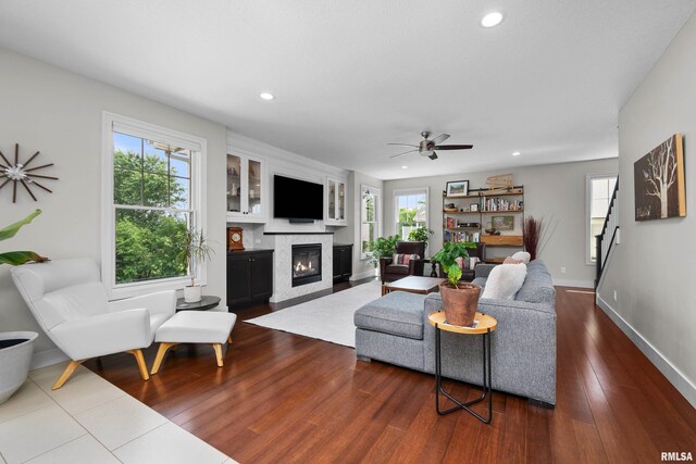 5727 Charlie Chase Ln, Bettendorf, IA 52722 - living area with a glass covered fireplace, recessed lighting, ceiling fan, and dark wood-type flooring