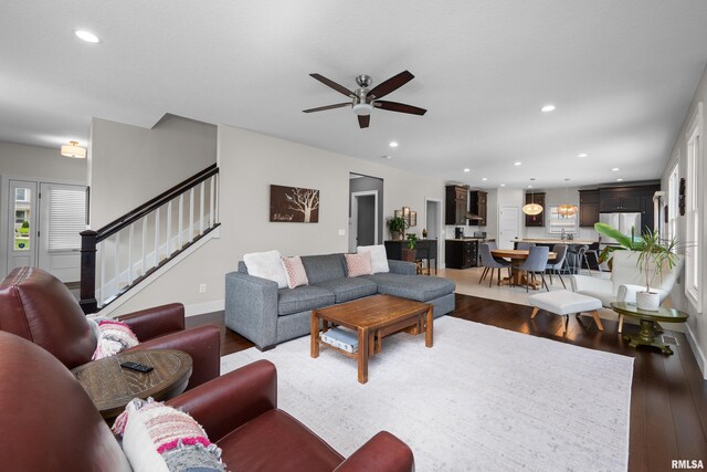 5727 Charlie Chase Ln, Bettendorf, IA 52722 - living area with wood finished floors, a ceiling fan, stairs, and recessed lighting