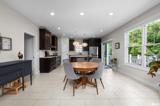 5727 Charlie Chase Ln, Bettendorf, IA 52722 - dining area featuring recessed lighting