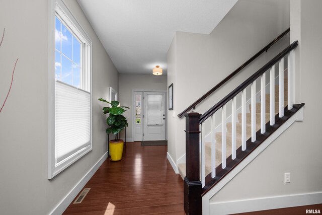 5727 Charlie Chase Ln, Bettendorf, IA 52722 - entryway with wood finished floors and stairway