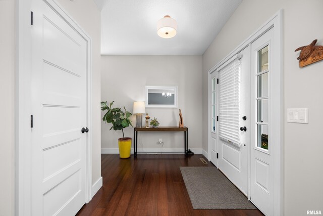 5727 Charlie Chase Ln, Bettendorf, IA 52722 - entryway featuring dark wood-style flooring and baseboards