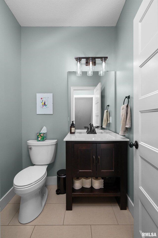 5727 Charlie Chase Ln, Bettendorf, IA 52722 - bathroom featuring vanity and tile patterned flooring