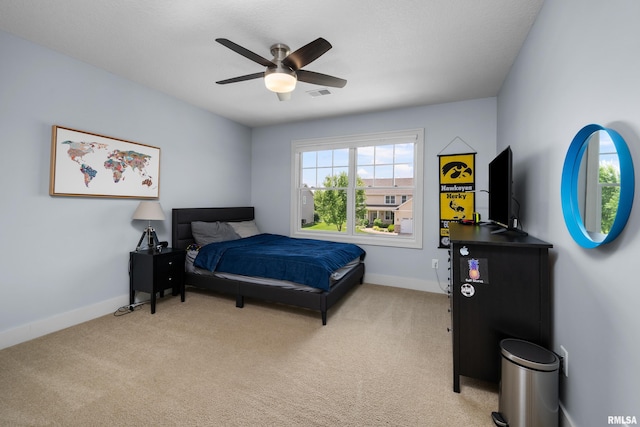5727 Charlie Chase Ln, Bettendorf, IA 52722 - bedroom with light colored carpet and a ceiling fan