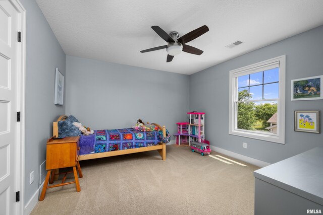 5727 Charlie Chase Ln, Bettendorf, IA 52722 - bedroom featuring carpet floors and ceiling fan