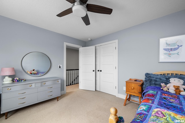 5727 Charlie Chase Ln, Bettendorf, IA 52722 - bedroom with light carpet, a closet, and a ceiling fan