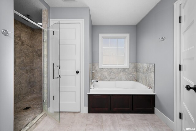 5727 Charlie Chase Ln, Bettendorf, IA 52722 - bathroom featuring a garden tub and a stall shower