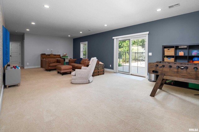 5727 Charlie Chase Ln, Bettendorf, IA 52722 - living room with recessed lighting and carpet flooring