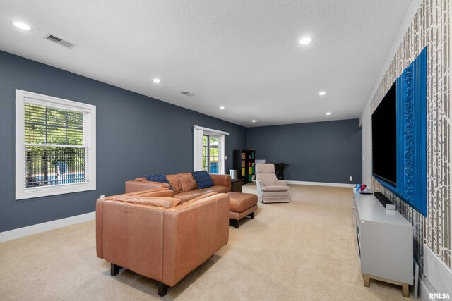 5727 Charlie Chase Ln, Bettendorf, IA 52722 - living room featuring light colored carpet and recessed lighting