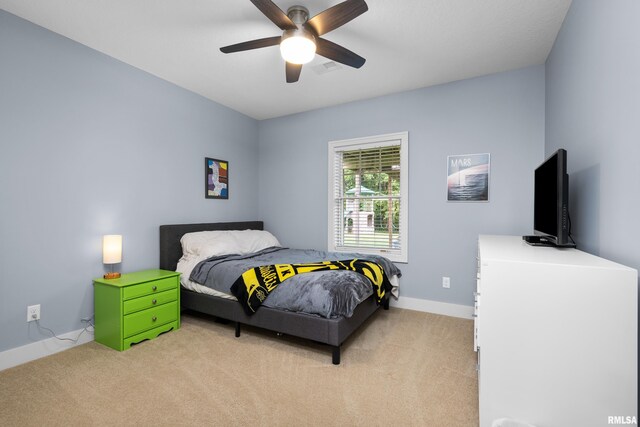 5727 Charlie Chase Ln, Bettendorf, IA 52722 - bedroom featuring light colored carpet and ceiling fan
