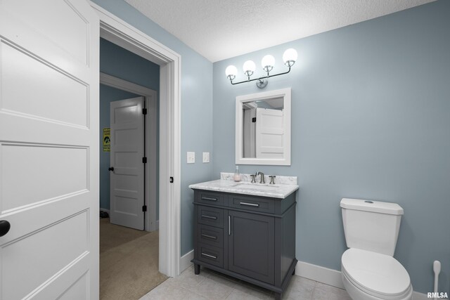 5727 Charlie Chase Ln, Bettendorf, IA 52722 - bathroom featuring vanity and a textured ceiling