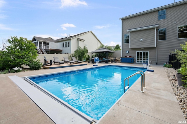 5727 Charlie Chase Ln, Bettendorf, IA 52722 - view of swimming pool featuring a gazebo and a patio area