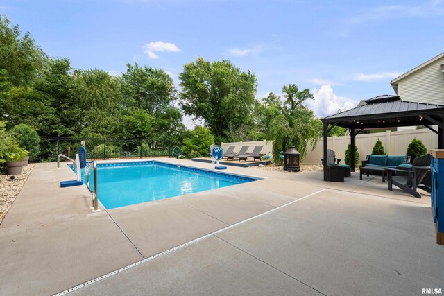 5727 Charlie Chase Ln, Bettendorf, IA 52722 - view of swimming pool with an outdoor living space, a gazebo, and a patio area