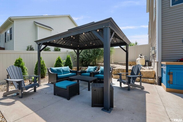 5727 Charlie Chase Ln, Bettendorf, IA 52722 - fenced backyard featuring a gazebo, an outdoor living space, and a patio area