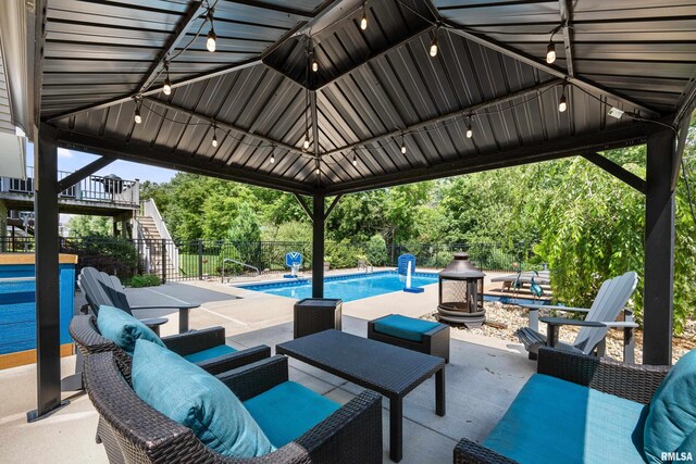 5727 Charlie Chase Ln, Bettendorf, IA 52722 - fenced backyard with stairs and a patio area