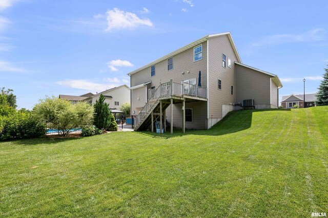 5727 Charlie Chase Ln, Bettendorf, IA 52722 - back of house featuring stairs, a deck, and a yard
