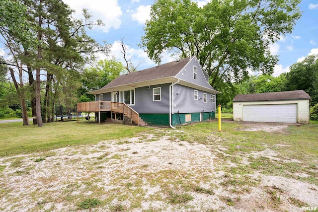 183 Island Ave, East Moline, IL 61244 - back of house with a garage, an outdoor structure, a wooden deck, a lawn, and stairs
