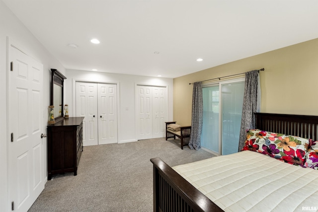 183 Island Ave, East Moline, IL 61244 - bedroom featuring light carpet, multiple closets, access to exterior, and recessed lighting