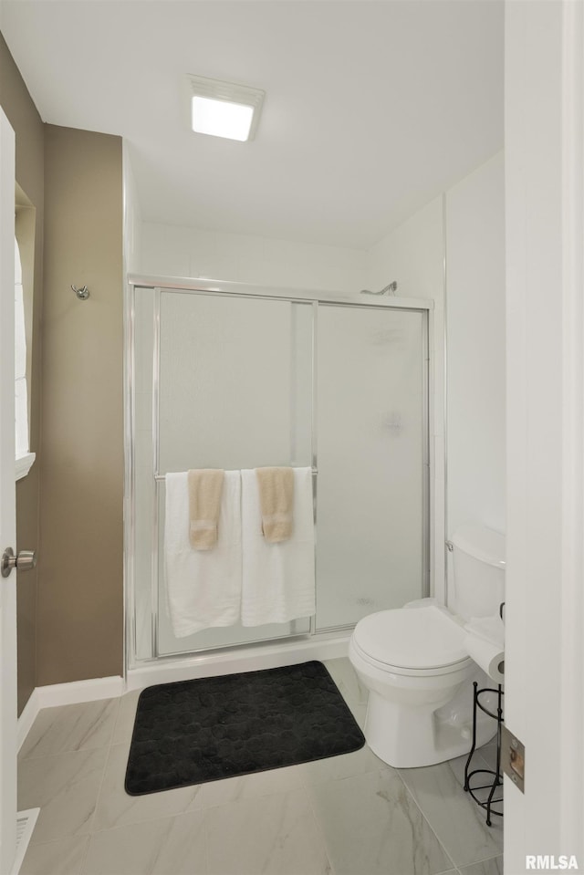 183 Island Ave, East Moline, IL 61244 - bathroom with a stall shower and marble look tiles