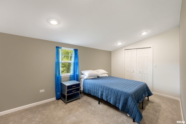 183 Island Ave, East Moline, IL 61244 - bedroom with light carpet, lofted ceiling, and a closet