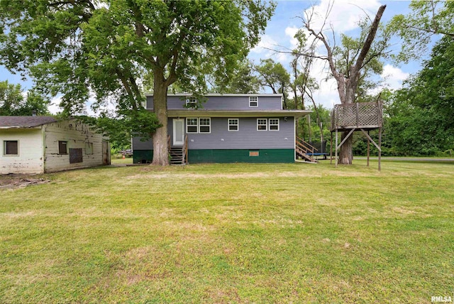 183 Island Ave, East Moline, IL 61244 - back of house featuring a lawn and entry steps